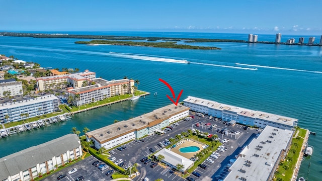 birds eye view of property with a water view