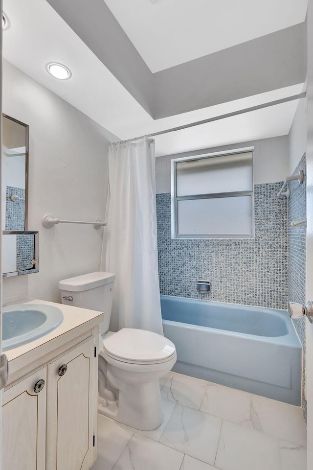 full bathroom featuring shower / bathtub combination with curtain, vanity, and toilet