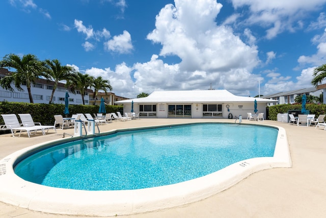 view of swimming pool with a patio area