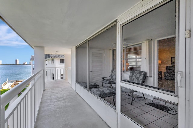 balcony featuring a water view