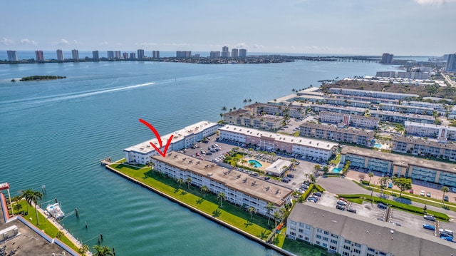 birds eye view of property with a water view