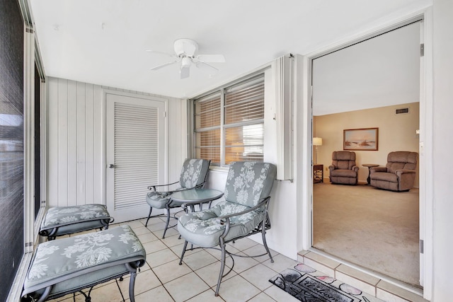 sunroom / solarium with ceiling fan