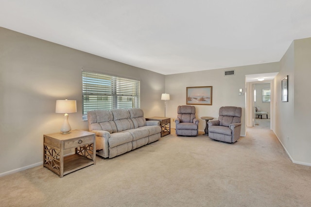 living room featuring light carpet