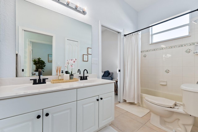 full bathroom featuring tile patterned flooring, vanity, toilet, and shower / bath combo