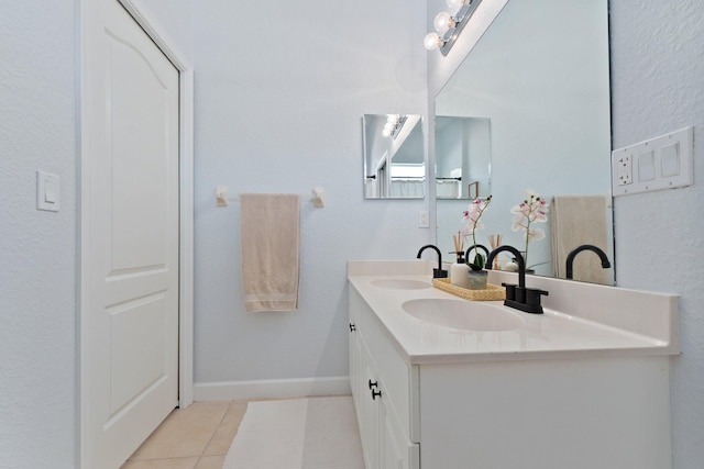 bathroom featuring tile patterned flooring and vanity