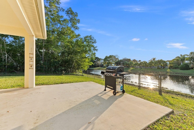 view of patio / terrace featuring a water view and grilling area