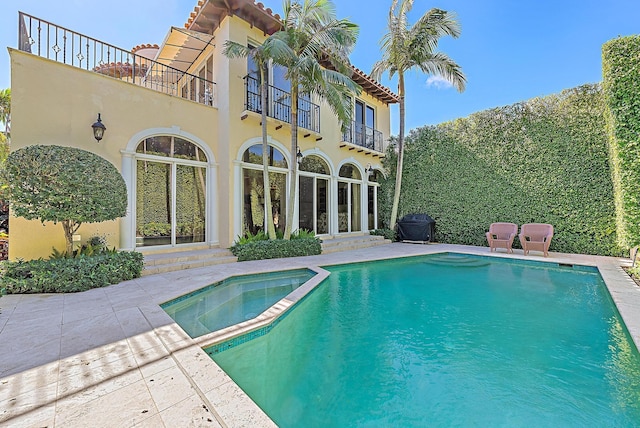 view of pool featuring a patio area