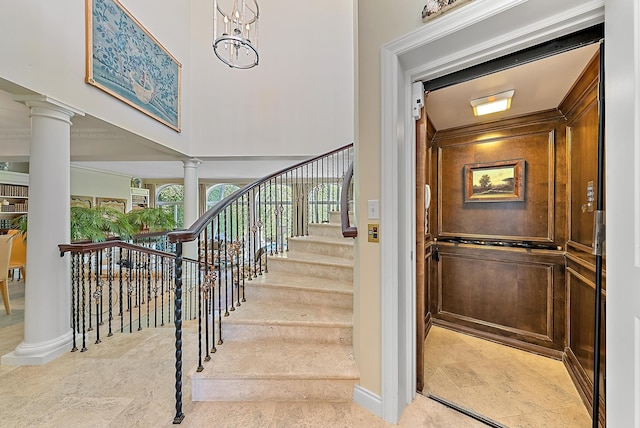 staircase with ornate columns