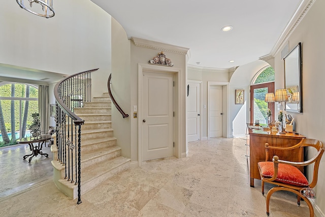 stairway featuring a wealth of natural light and ornamental molding