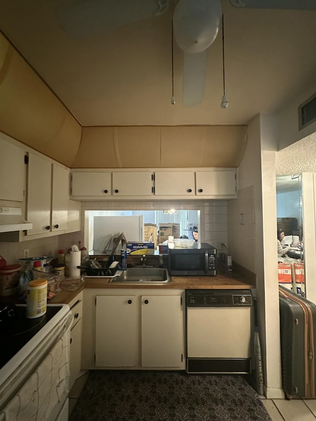 kitchen featuring white cabinets, white appliances, and decorative backsplash