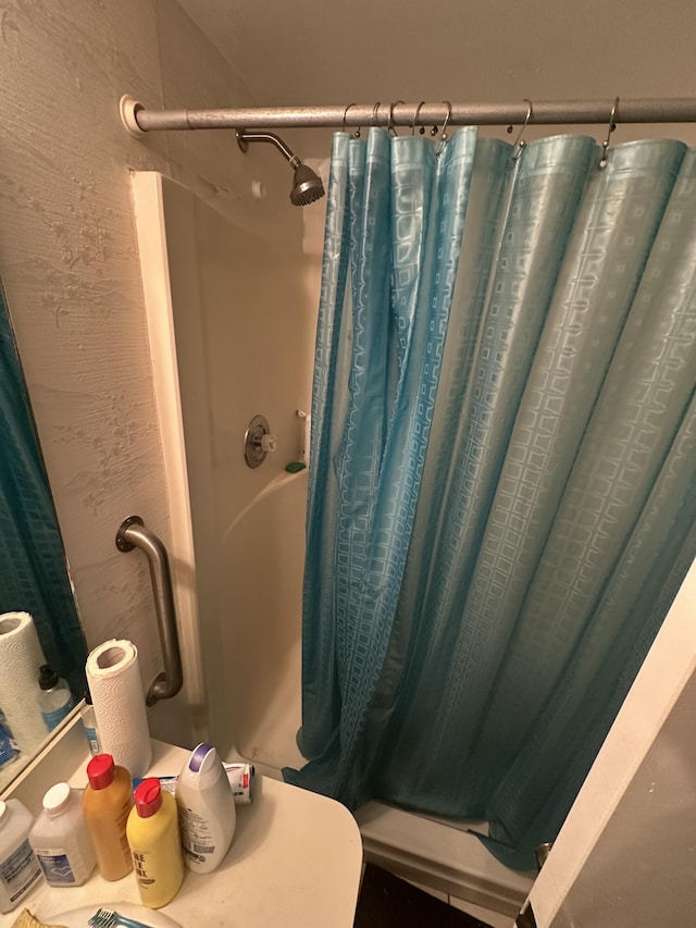 bathroom with curtained shower