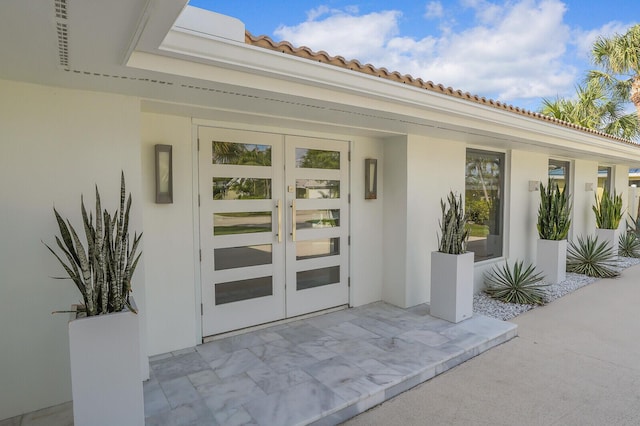 entrance to property with french doors and a patio