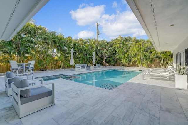 view of pool featuring a patio