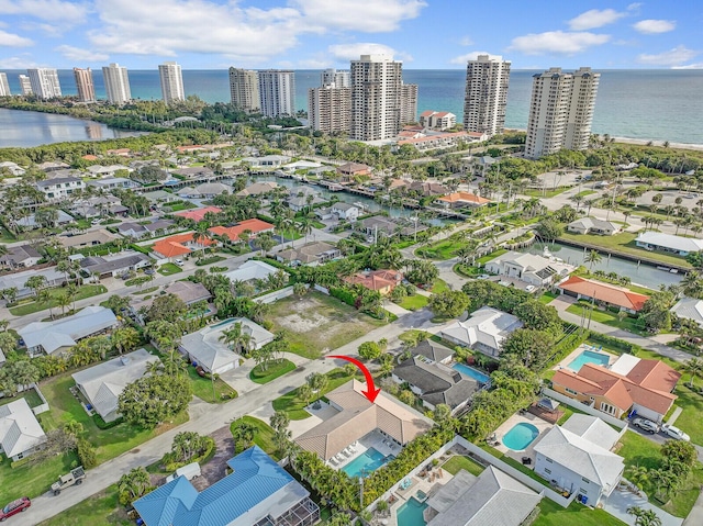 birds eye view of property with a water view