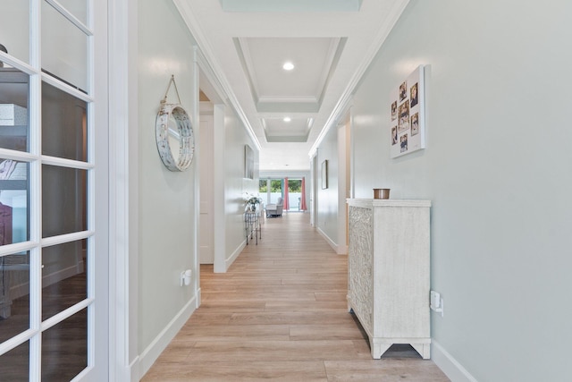 hallway with crown molding and light hardwood / wood-style floors