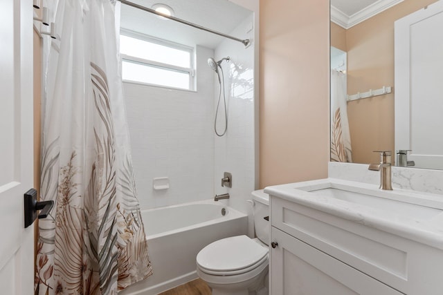 full bathroom with vanity, crown molding, shower / bath combination with curtain, and toilet