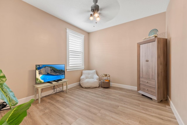 sitting room featuring ceiling fan and light hardwood / wood-style floors