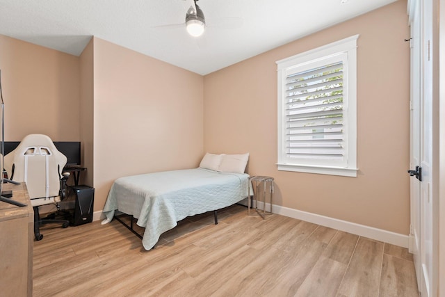 bedroom featuring ceiling fan and light wood-type flooring