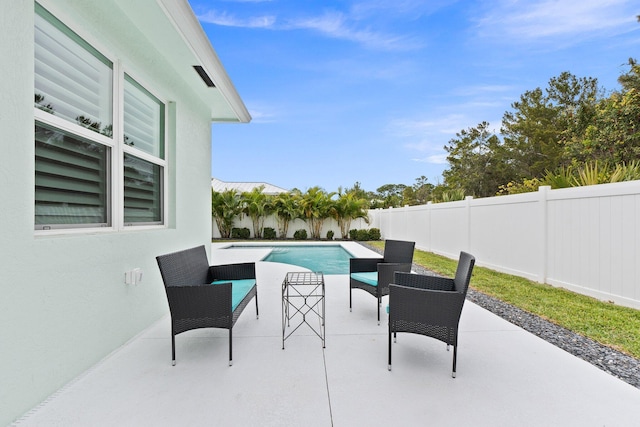 view of patio / terrace featuring a fenced in pool