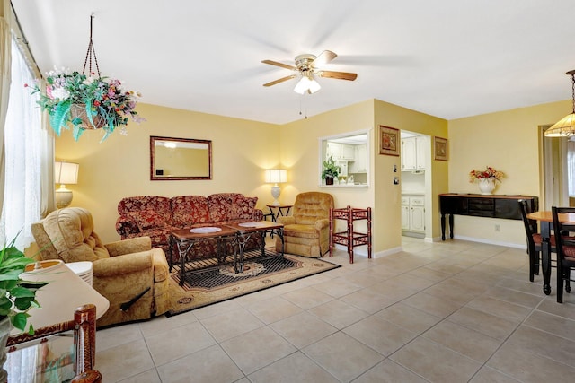 tiled living room featuring ceiling fan