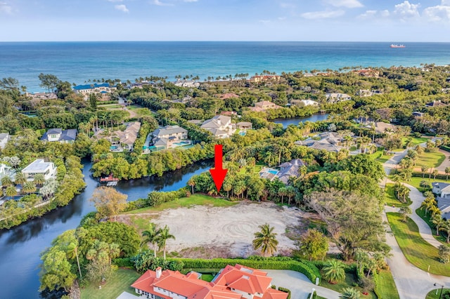 birds eye view of property featuring a water view