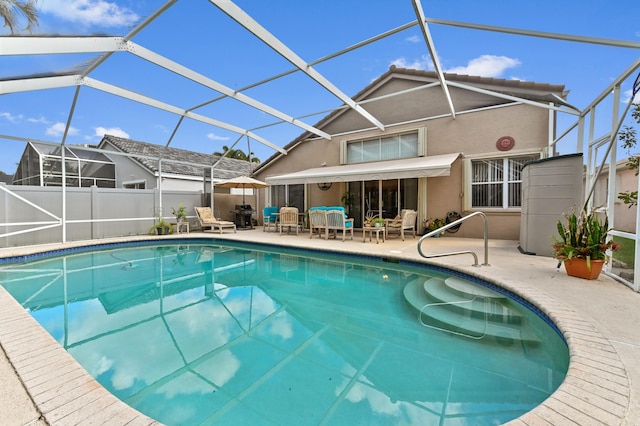 view of pool featuring a fenced in pool, a patio area, glass enclosure, and fence