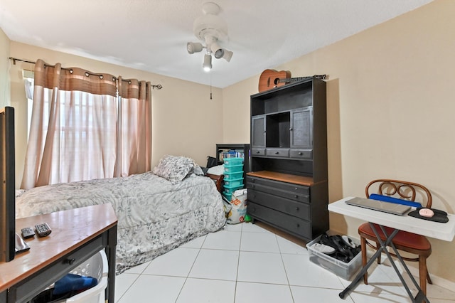 tiled bedroom with ceiling fan