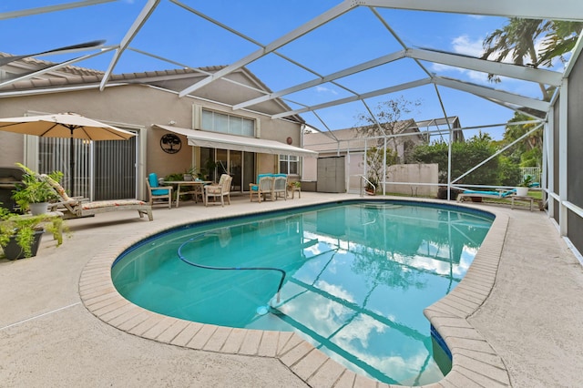 pool with a jacuzzi, a patio, and a lanai