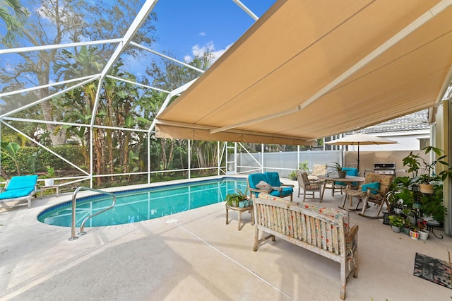 view of swimming pool featuring a grill, a patio area, and glass enclosure