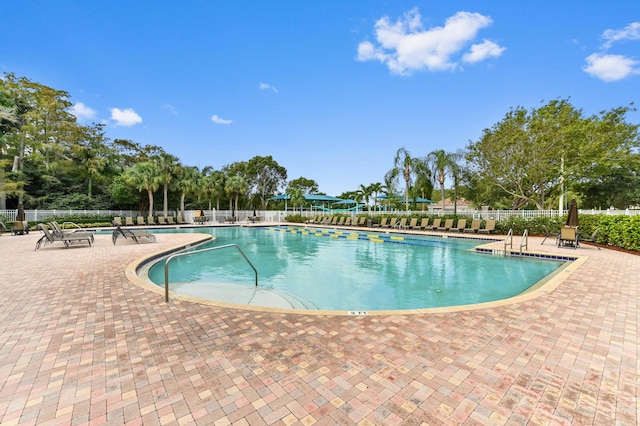 view of swimming pool featuring a patio area