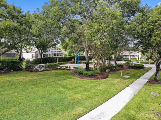 view of property's community featuring a yard