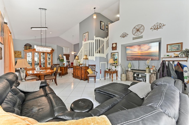 tiled living room featuring high vaulted ceiling