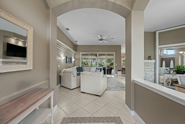 living room with light tile patterned floors and ceiling fan