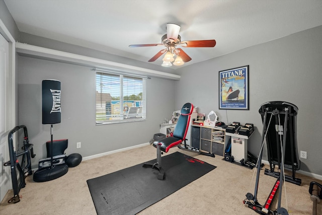 exercise room featuring ceiling fan and carpet