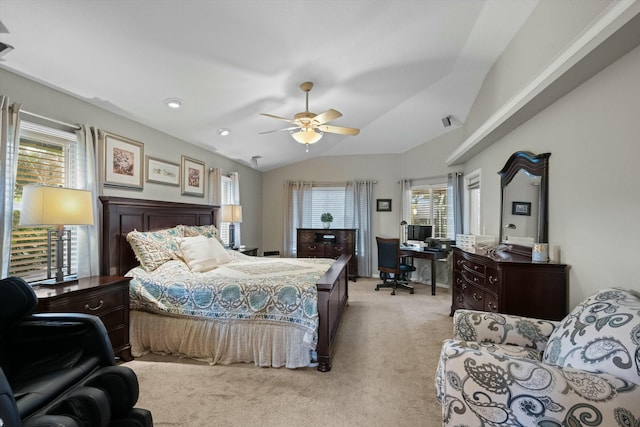 carpeted bedroom featuring ceiling fan, vaulted ceiling, and multiple windows