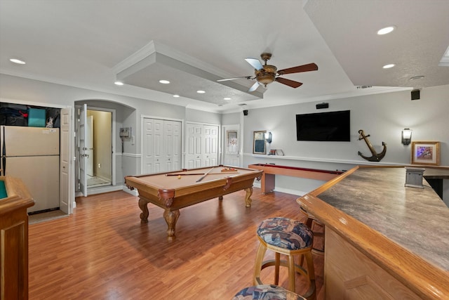 game room featuring billiards, hardwood / wood-style flooring, ornamental molding, and ceiling fan