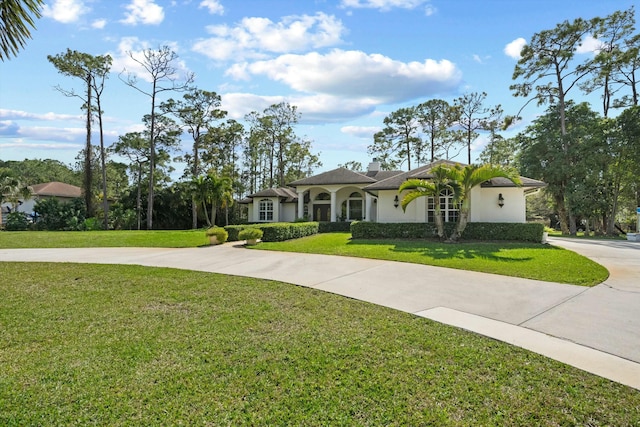 view of front of property with a front lawn