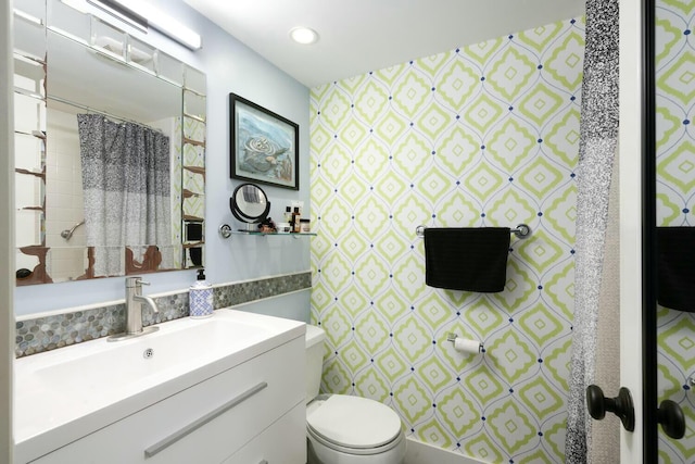 bathroom with vanity and toilet