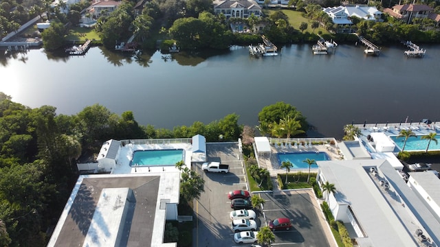 birds eye view of property featuring a water view