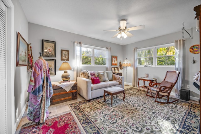 tiled living room with ceiling fan