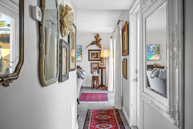 corridor featuring light tile patterned flooring