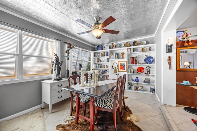 dining room featuring ornamental molding, light tile patterned floors, and ceiling fan