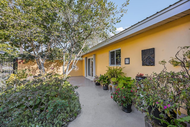 view of property exterior featuring a patio area