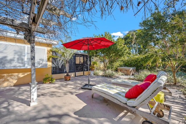 view of patio / terrace featuring a sunroom