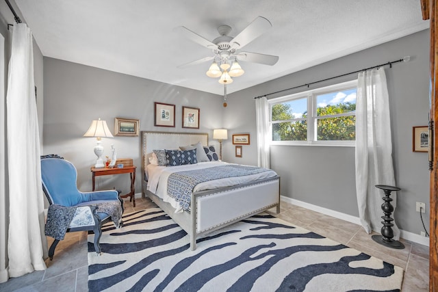 bedroom with light tile patterned floors and ceiling fan