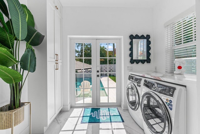 washroom with separate washer and dryer and french doors