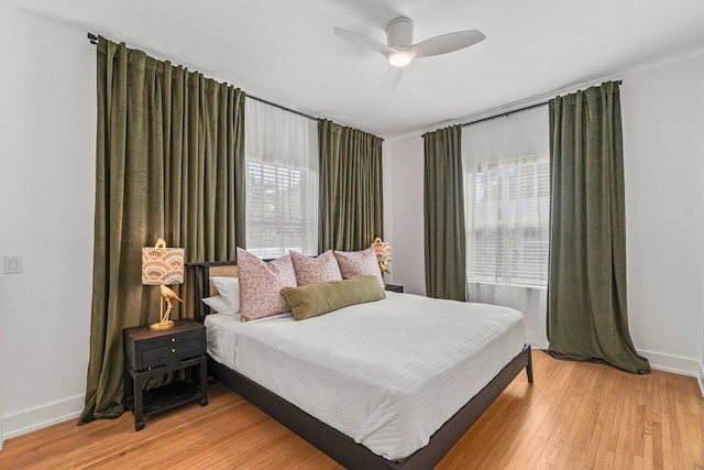 bedroom with wood-type flooring and ceiling fan