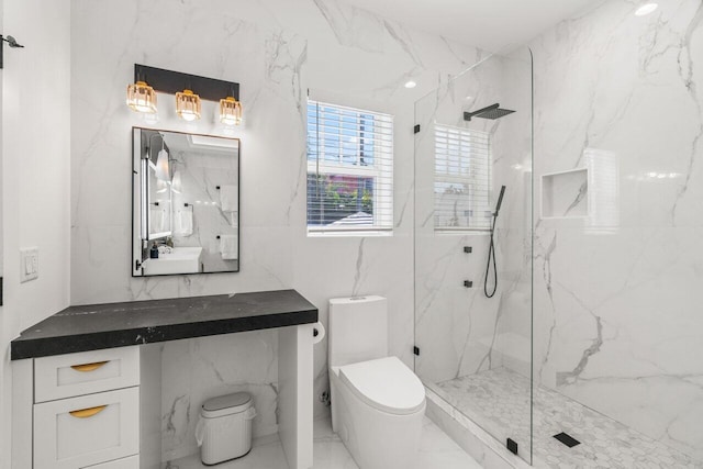 bathroom featuring a tile shower, tile walls, and toilet