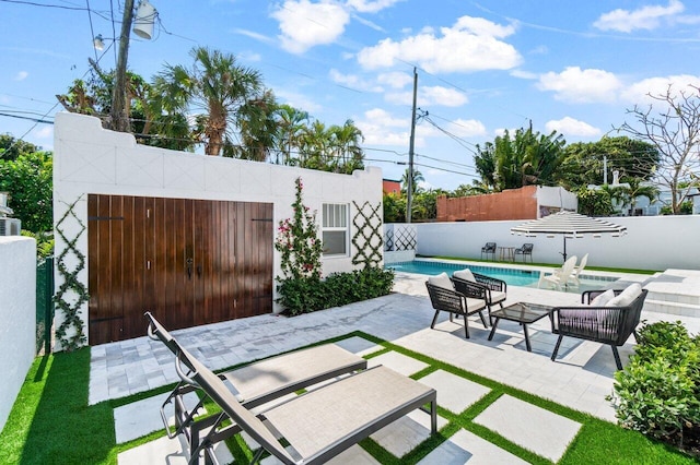 view of patio / terrace featuring a fenced in pool