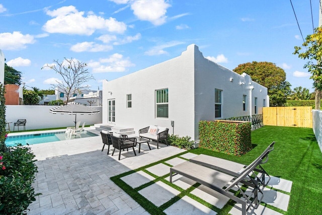 view of patio with a fenced in pool